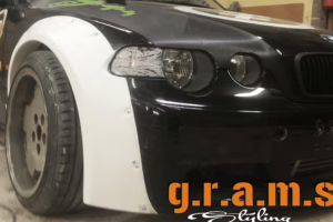 BMW E46 Compact Rocket Bunny Style wide fender flares in carbon fiber, fiberglass, and carbon kevlar for performance and customization.